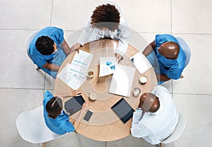 Lets talk about alternative treatments for our patients. High angle shot of a group of medical practitioners having a