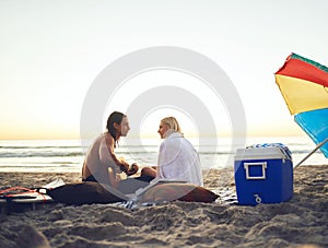 Lets think of a song together. Rearview shot of an affectionate young couple serenading each other during a date on the