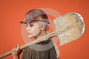 lets work. labor day. woman in boilersuit and helmet. female builder hold shovel.
