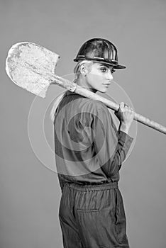 lets work. labor day. woman in boilersuit and helmet. female builder hold shovel.