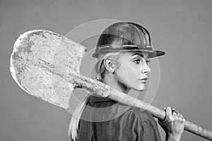 lets work. labor day. woman in boilersuit and helmet. female builder hold shovel.