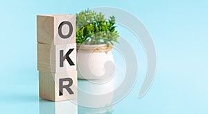 Letter of the alphabet of OKR on a light blu background