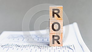 Letter of the alphabet of ROR on a grey background. ror - rate of return