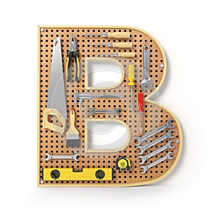 Letter B. Alphabet from the tools on the metal pegboard isolated photo