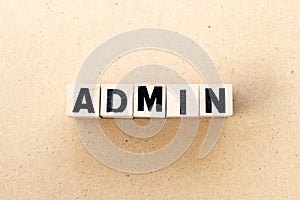 Letter block in word admin on wood background