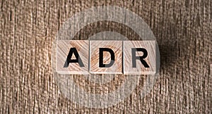 Letter block in word ADR - adverse drug reaction on table photo