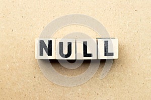 Letter block in word null on wood background