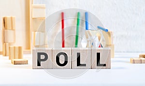 Letter block in word poll on wood background