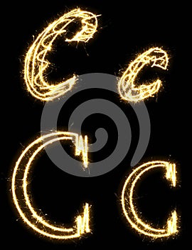 Letter C. Alphabet made by sparkler. Isolated on a black background.