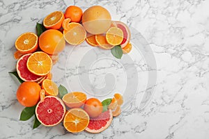 Letter C made with citrus fruits on table as vitamin representation, flat lay. Space for text