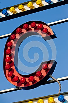 Letter C in red light bulbs