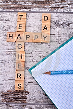 Letter cubes is making up happy teacher`s day.