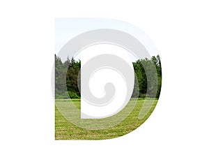 Letter D of the alphabet made with landscape with grass, forest and a blue sky