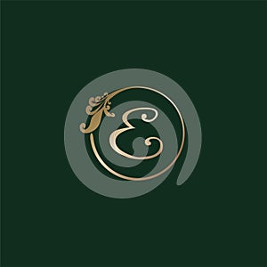 Letter E Decorative Alphabet Logo isolated on green Background. Luxury gold ring Initial Abjad Logo Design Template. Elegant Curl