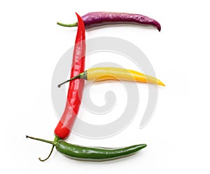 Letter E made from green yellow red chilli