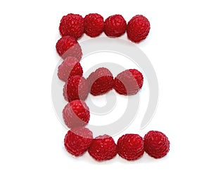 letter E made from raspberries. isolated on white background for birthday party