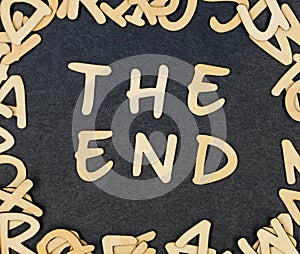 Letter `The end` composed of wooden letters.