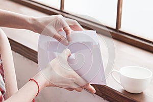 Letter in an envelope and a coffee cup