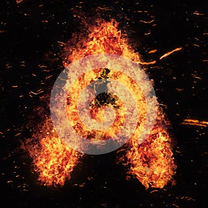 Letter A flame explosion shape with embers and sparks