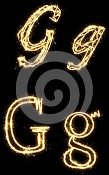 Letter G. Alphabet made by sparkler. Isolated on a black background.