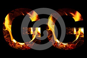 The letter G made from fire and burning wood on a black background, a double version of the alphabet for decorative signatures