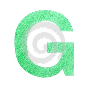 Letter G written with green pencil on background, top view