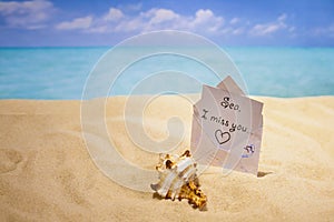 Letter `I miss the sea`, sea coast, hot sand