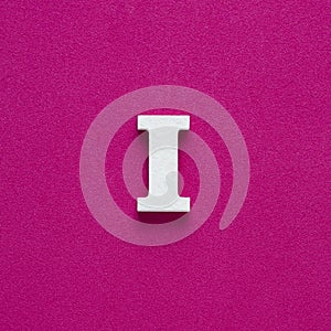 Letter I uppercase - White wood font on rhodamine red background