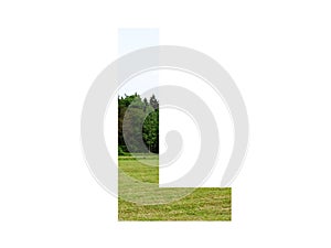 Letter L of the alphabet made with landscape with grass, forest and a blue sky