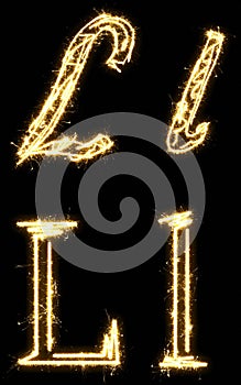 Letter L. Alphabet made by sparkler. Isolated on a black background.