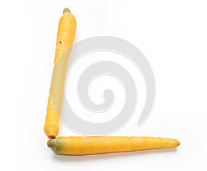 Letter L made from yellow carrots