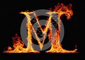 Letter M burning in fire, isolated on black background.