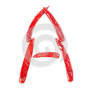 Letter A made from red hot chili peppers. Isolated on white background