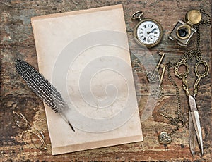Letter paper with vintage writing tools. Feather pen and inkwell