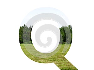 Letter q of the alphabet made with landscape with grass, forest and a blue sky