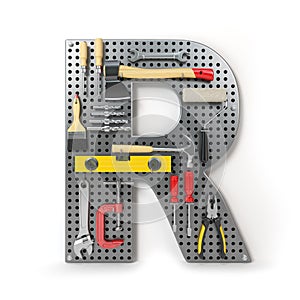 Letter R. Alphabet from the tools on the metal pegboard isolated photo