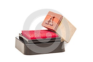 Letter A. Rubber stamp with wooden handle on red ink cartridge