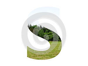 Letter S of the alphabet made with landscape with grass, forest and a blue sky