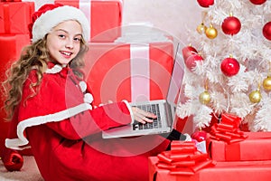 Letter for santa. Wish list. Child santa enjoy christmas eve. Girl little kid typing letter to santa on laptop. Child