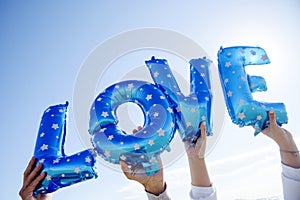 Letter-shaped balloons forming the word love