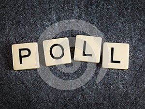 Letter tiles on black slate background spelling Poll