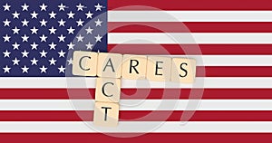 Letter Tiles CARES Act On US Flag, 3d illustration