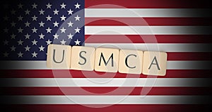 Letter Tiles USMCA On US Flag, 3d illustration