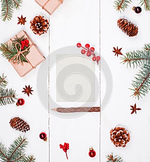 Letter to Santa on holiday background with Christmas gifts, Fir branches, pine cones, red decorations. Xmas and Happy New Year