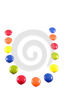 Letter U made of colored chocolates