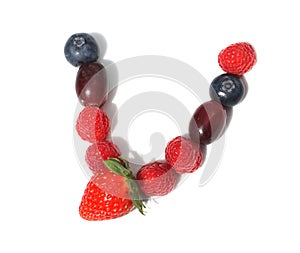 letter v made from raspberry, strawberries with green leaf, blueberries, grape. isolated berries letters for party