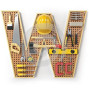 Letter W. Alphabet from the tools on the metal pegboard isolated photo