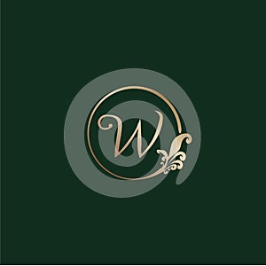 Letter W Decorative Alphabet Logo isolated on green Background. Luxury gold ring Initial Abjad Logo Design Template. Elegant Curl