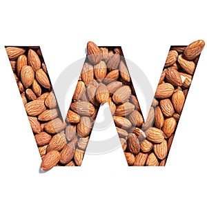 Letter W of English alphabet made of natural nuts and paper cut isolated on white. Typeface of healthful almonds