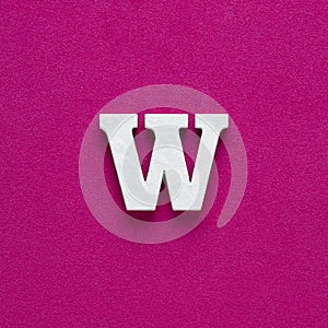 Letter W uppercase - White wood font on rhodamine red background